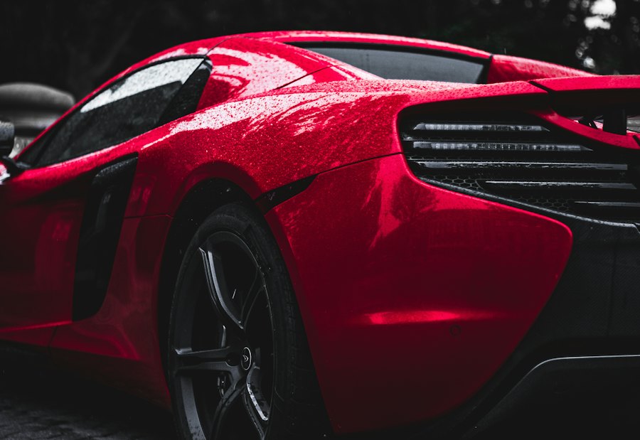 Rear of a wet red McLaren